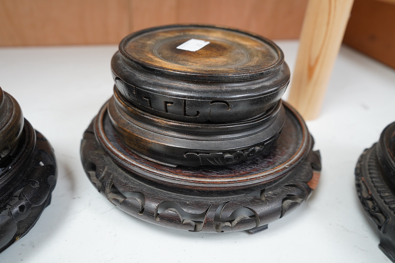 A group of Chinese hardwood stands largest 21cm in diameter. Condition - fair, some chips